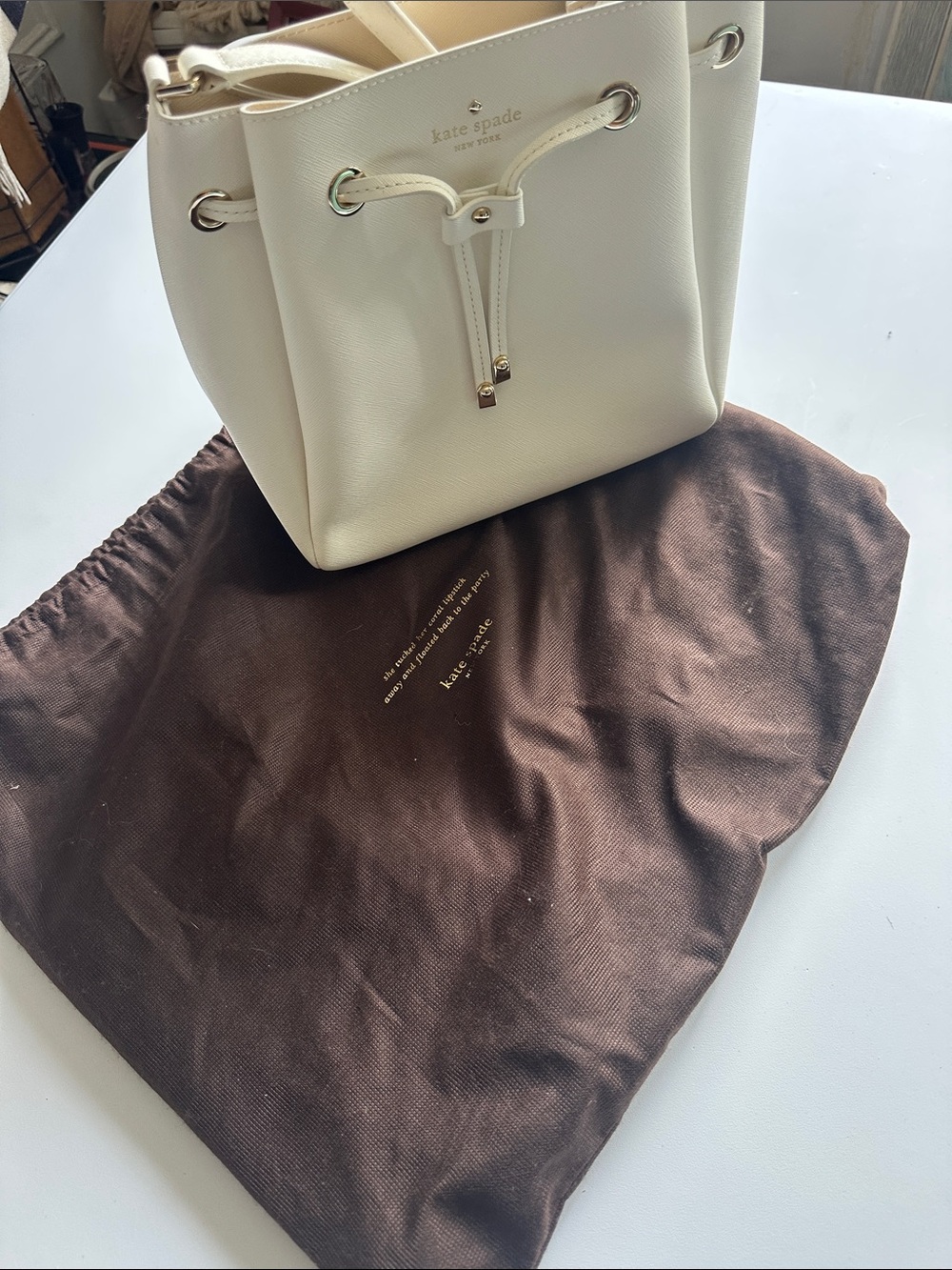 P—kate spade Cream Drawstring Bucket Bag with Gold Hardware